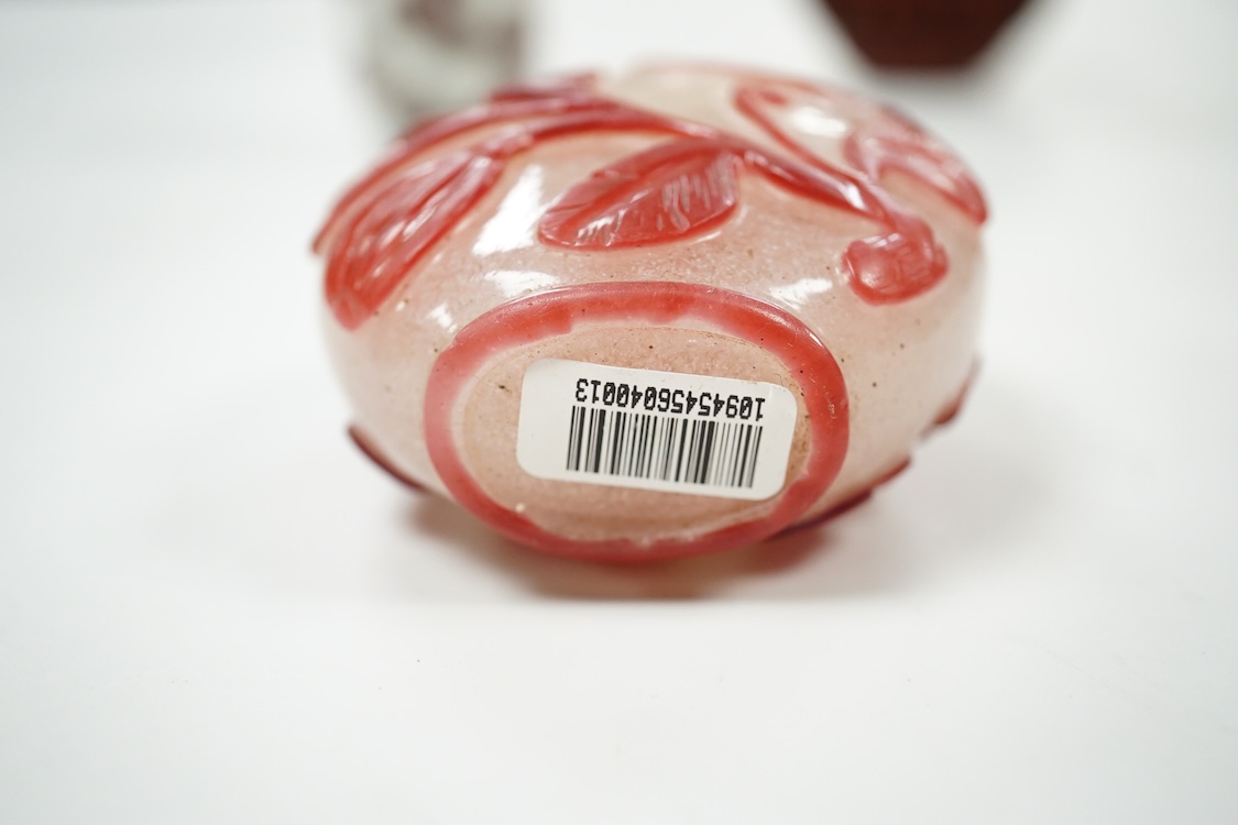 A Chinese cinnabar lacquer snuff bottle, a glass overlay snuff bottle and an underglaze copper red snuff bottle-9cm high (3)